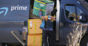 Amazon boosts worker pay, cuts health plan costs