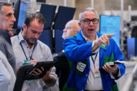 Stocks rise near records as oil surges on Russia sanctions