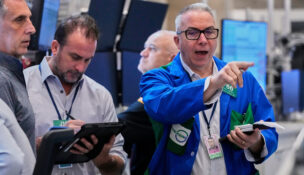 Stocks rise near records as oil surges on Russia sanctions
