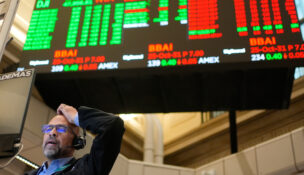 Stocks slip from records amid trade, tech earnings news