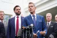 Transportation Secretary Sean Duffy, from right, speaks alongside Vice President JD Vance and Chris Sununu, president & CEO of Airlines for America, about the impact of the government shutdown on the aviation industry, outside of the West Wing of the White House, Thursday, Oct. 30, 2025, in Washington. (AP Photo/Jacquelyn Martin)