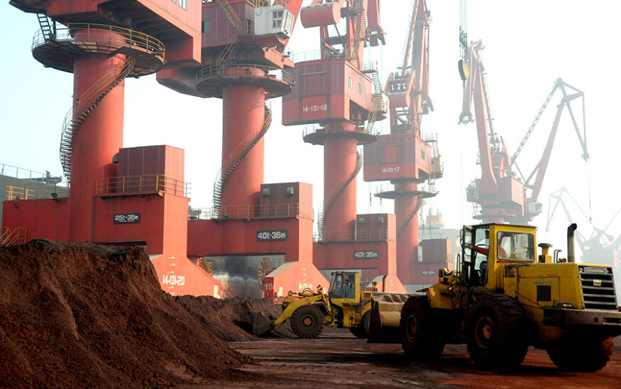 FILE PHOTO: Workers transport soil containing rare earth elements for export at a port in Lianyungang, Jiangsu province, China October 31, 2010. REUTERS/Stringer/File Photo