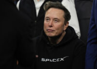 FILE - Elon Musk attends the finals for the NCAA wrestling championship, Saturday, March 22, 2025, in Philadelphia. (AP Photo/Matt Rourke, file)