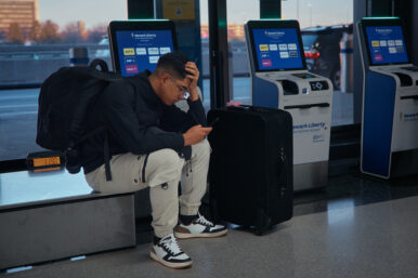 A passenger flying with Arajet to Santo Domingo waits to check in at Newark Liberty International Airport on Friday, Nov. 7, 2025 in Newark, N.J. (AP Photo/Andres Kudacki)