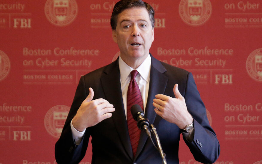 FILE - FBI Director James Comey gestures as he speaks on cyber security at the first Boston Conference of Cyber Security at Boston College, March 8, 2017, in Boston. (AP Photo/Stephan Savoia, File)