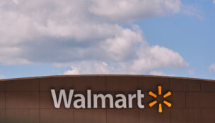 FILE - Clouds pass over the Walmart store, Thursday, Aug. 14, 2025, in Manchester, N.H. (AP Photo/Charles Krupa, File)
