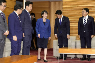 Japan's Prime Minister Sanae Takaichi, center, arrives for a cabinet meeting at her office in Tokyo Friday, Nov. 21, 2025. (Yuki Sato/Kyodo News via AP)