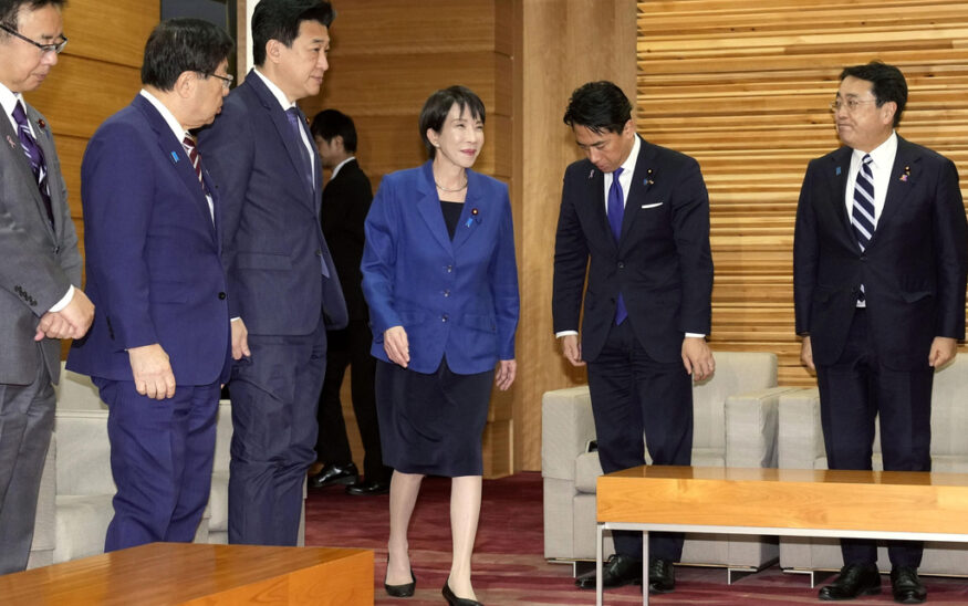 Japan's Prime Minister Sanae Takaichi, center, arrives for a cabinet meeting at her office in Tokyo Friday, Nov. 21, 2025. (Yuki Sato/Kyodo News via AP)