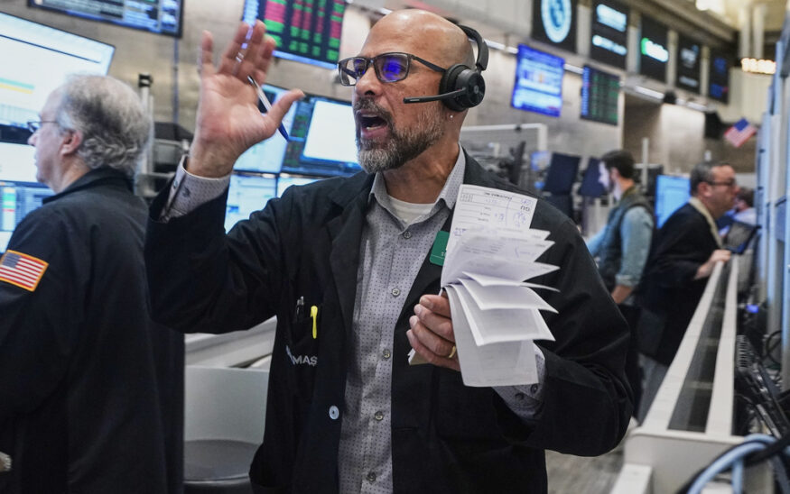 Options trader Steven Rodriguez works on the floor of the New York Stock Exchange, Friday, Nov. 21, 2025. (AP Photo/Richard Drew)