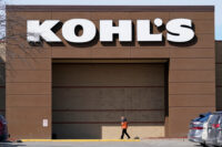 FILE- A woman arrives at a Kohl's store in West Des Moines, Iowa on Feb. 25, 2021.(AP Photo/Charlie Neibergall, File)