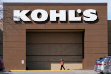 FILE- A woman arrives at a Kohl's store in West Des Moines, Iowa on Feb. 25, 2021.(AP Photo/Charlie Neibergall, File)