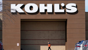 FILE- A woman arrives at a Kohl's store in West Des Moines, Iowa on Feb. 25, 2021.(AP Photo/Charlie Neibergall, File)