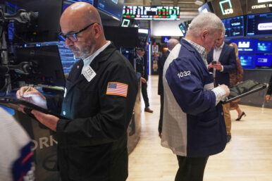Traders Fred Demarco, left, and Edward McCarthy work on the floor of the New York Stock Exchange, Monday, Nov. 24, 2025. (AP Photo/Richard Drew)
