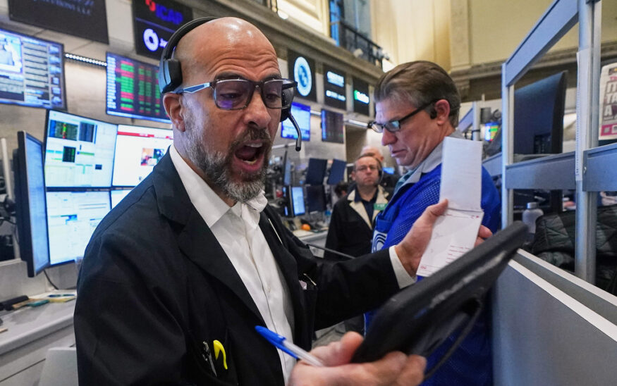Options trader Steven Rodriguez, left, works on the floor of the New York Stock Exchange, Monday, Nov. 24, 2025. (AP Photo/Richard Drew)