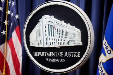 FILE - The logo for the Justice Department is seen before a news conference at the Department of Justice on Aug. 23, 2024, in Washington. (AP Photo/Mark Schiefelbein, File)