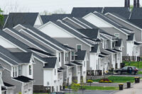 FILE - Newly developed homes sit in a row in Eagleville, Pa., April 28, 2023. (AP Photo/Matt Rourke, File)
