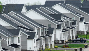 FILE - Newly developed homes sit in a row in Eagleville, Pa., April 28, 2023. (AP Photo/Matt Rourke, File)