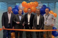 Xcelerate Solutions' leadership team cut the ribbon on its new headquarters space on Tuesday. From left: Mike Brokaw, Mark Drever, David Kapusta, Vivek Malhotra and Doug Kollme. Photo courtesy Fairfax County Economic Development Authority.