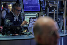A trader works on the floor at the New York Stock Exchange (NYSE) in New York City, U.S., December 11, 2025. REUTERS/Jeenah Moon