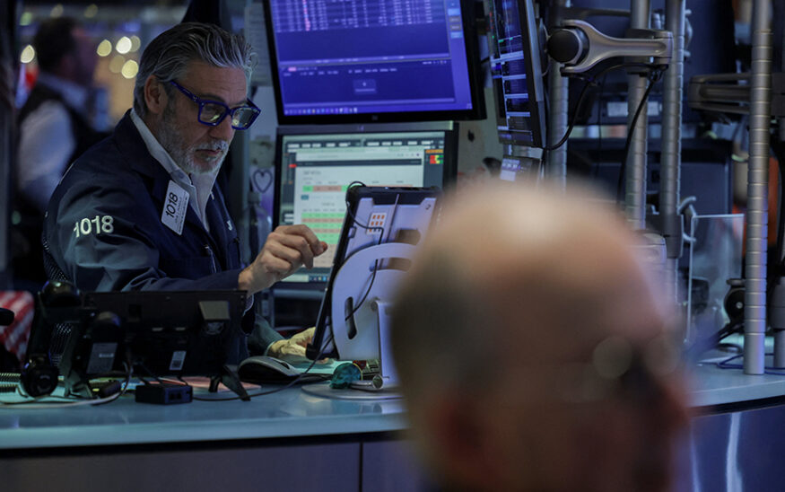 A trader works on the floor at the New York Stock Exchange (NYSE) in New York City, U.S., December 11, 2025. REUTERS/Jeenah Moon