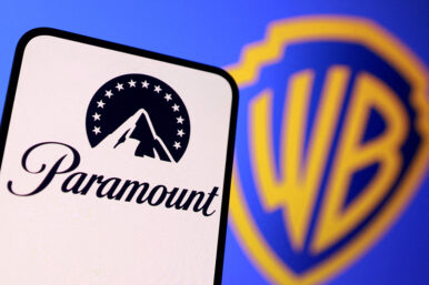 FILE PHOTO: Paramount and Warner Bros logos are seen in this illustration taken December 8, 2025. REUTERS/Dado Ruvic/Illustration/File Photo
