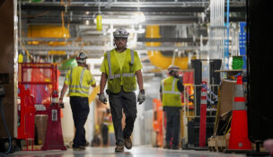 FILE PHOTO: People work inside the Microsoft data center campus' Graphical Processing Unit, currently under construction, after Microsoft's Vice Chair and President Brad Smith announced a plan to spend $4 billion on an additional artificial intelligence data center, in Mount Pleasant, Wisconsin, U.S., September 18, 2025. REUTERS/Audrey Richardson/File Photo