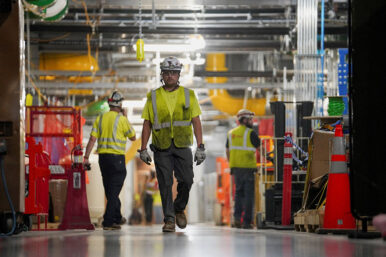 FILE PHOTO: People work inside the Microsoft data center campus' Graphical Processing Unit, currently under construction, after Microsoft's Vice Chair and President Brad Smith announced a plan to spend $4 billion on an additional artificial intelligence data center, in Mount Pleasant, Wisconsin, U.S., September 18, 2025. REUTERS/Audrey Richardson/File Photo