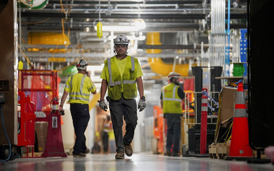 FILE PHOTO: People work inside the Microsoft data center campus' Graphical Processing Unit, currently under construction, after Microsoft's Vice Chair and President Brad Smith announced a plan to spend $4 billion on an additional artificial intelligence data center, in Mount Pleasant, Wisconsin, U.S., September 18, 2025. REUTERS/Audrey Richardson/File Photo
