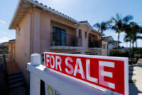 FILE PHOTO: A for sale sign is shown for a residential home in Encinitas, California, U.S. July 25, 2025. REUTERS/Mike Blake/File Photo