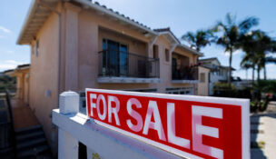 FILE PHOTO: A for sale sign is shown for a residential home in Encinitas, California, U.S. July 25, 2025. REUTERS/Mike Blake/File Photo