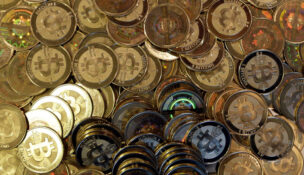 FILE - Bitcoin tokens are seen on April 3, 2013, in Sandy, Utah. (AP Photo/Rick Bowmer, File)