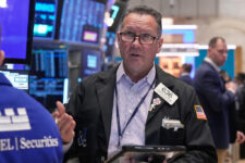 Trader Edward Curran works on the floor of the New York Stock Exchange, Monday, Nov. 24, 2025. (AP Photo/Richard Drew)
