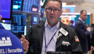 Trader Edward Curran works on the floor of the New York Stock Exchange, Monday, Nov. 24, 2025. (AP Photo/Richard Drew)