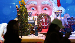 Black Friday Shoppers queue to enter Macy's flagship store in New York on Friday, Nov. 28, 2025. (AP Photo/Angelina Katsanis)