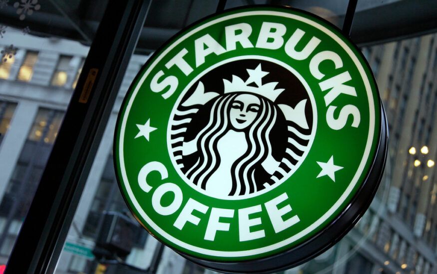 FILE - This Dec. 20, 2010 file photo shows signage at a Starbucks store in New York. (AP Photo/Richard Drew, File)