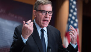Sen. Mark Warner, D-Va., the top Democrat on the Senate Intelligence Committee, speaks about the Trump administration following reports that only Republican lawmakers received security briefings on the Trump-ordered military strikes against boats in the Caribbean, during a news conference at the Capitol in Washington, Thursday, Oct. 30, 2025. (AP Photo/J. Scott Applewhite, File)
