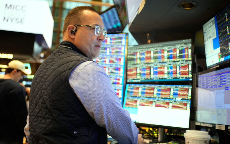 Anthony Matesic works on the floor at the New York Stock Exchange in New York, Wednesday, Dec. 10, 2025. (AP Photo/Seth Wenig)