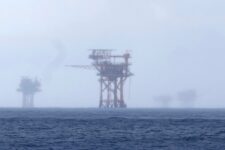 FILE - Oil platforms are visible through the haze near the Flower Garden Banks National Marine Sanctuary in the Gulf of Mexico, off the coast of Galveston, Texas, Saturday, Sept. 16, 2023. (AP Photo/LM Otero, File)