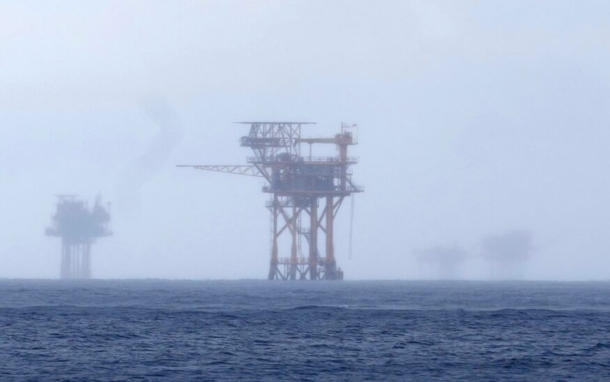 FILE - Oil platforms are visible through the haze near the Flower Garden Banks National Marine Sanctuary in the Gulf of Mexico, off the coast of Galveston, Texas, Saturday, Sept. 16, 2023. (AP Photo/LM Otero, File)