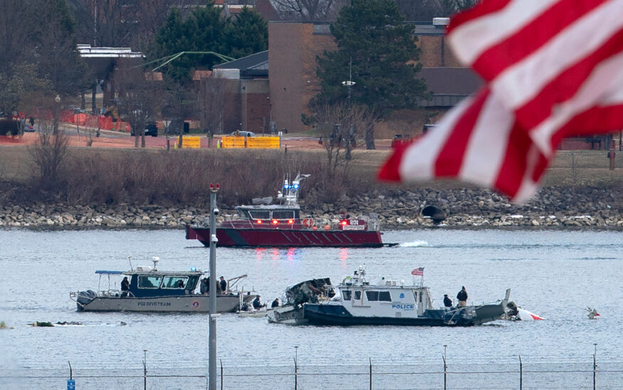 FILE - A diving team and police boat is seen near a wreckage site in the Potomac River, from Ronald Reagan Washington National Airport, Jan. 30, 2025, in Arlington, Va. (AP Photo/Jose Luis Magana, File)