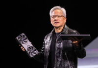 Nvidia CEO Jensen Huang holds a new Nvidia GeForce RTX 5090 graphics card and an RTX 5070 laptop as he gives a keynote address at CES 2025, an annual consumer electronics trade show, in Las Vegas, Nevada, U.S. January 6, 2025. REUTERS/Steve Marcus
