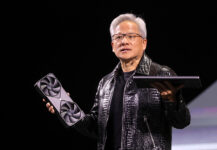 Nvidia CEO Jensen Huang holds a new Nvidia GeForce RTX 5090 graphics card and an RTX 5070 laptop as he gives a keynote address at CES 2025, an annual consumer electronics trade show, in Las Vegas, Nevada, U.S. January 6, 2025. REUTERS/Steve Marcus