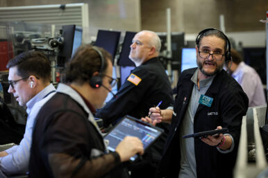 Chip stocks jump on AI optimism; Dow ends at record high