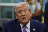 FILE PHOTO: U.S. President Donald Trump speaks as he signs an executive order on AI in the Oval Office at the White House in Washington, D.C., U.S. December 11, 2025. REUTERS/Al Drago/File Photo