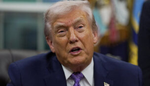 FILE PHOTO: U.S. President Donald Trump speaks as he signs an executive order on AI in the Oval Office at the White House in Washington, D.C., U.S. December 11, 2025. REUTERS/Al Drago/File Photo
