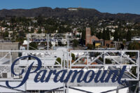 FILE PHOTO: A drone view shows a sign for Paramount in front of the Hollywood sign in Los Angeles, California, December 8, 2025. REUTERS/Daniel Cole/File Photo