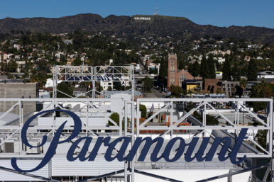 FILE PHOTO: A drone view shows a sign for Paramount in front of the Hollywood sign in Los Angeles, California, December 8, 2025. REUTERS/Daniel Cole/File Photo