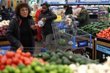 Customers shop for groceries at a Walmart Supercenter retail store in North Bergen, New Jersey, U.S., November 21, 2025. REUTERS/Mike Segar