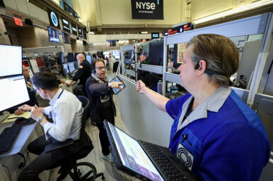 FILE PHOTO: Futures-options traders work on the floor at the New York Stock Exchange's NYSE American (AMEX) in New York City, U.S., January 13, 2026. REUTERS/Brendan McDermid/File Photo