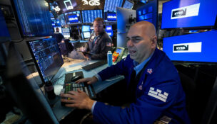 Traders work on the floor at the New York Stock Exchange (NYSE) in New York City, U.S., January 13, 2026. REUTERS/Brendan McDermid